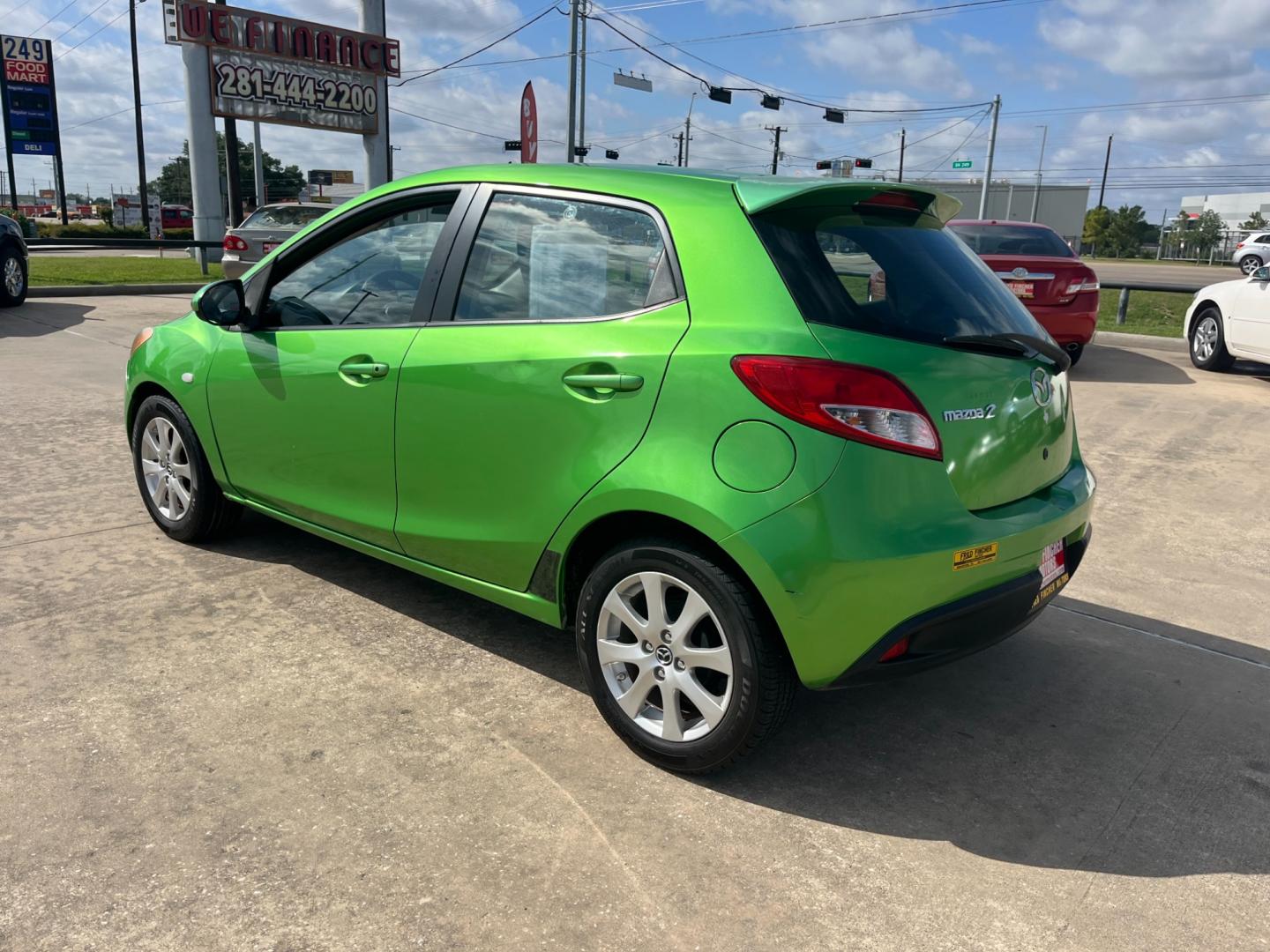 2013 green /black Mazda MAZDA2 Touring (JM1DE1LY1D0) with an 1.5L L4 DOHC 16V engine, Automatic transmission, located at 14700 Tomball Parkway 249, Houston, TX, 77086, (281) 444-2200, 29.928619, -95.504074 - Photo#4